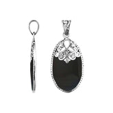 Sterling silver oval pendant with black shell inlay and delicate Balinese filigree design, handcrafted in Bali.